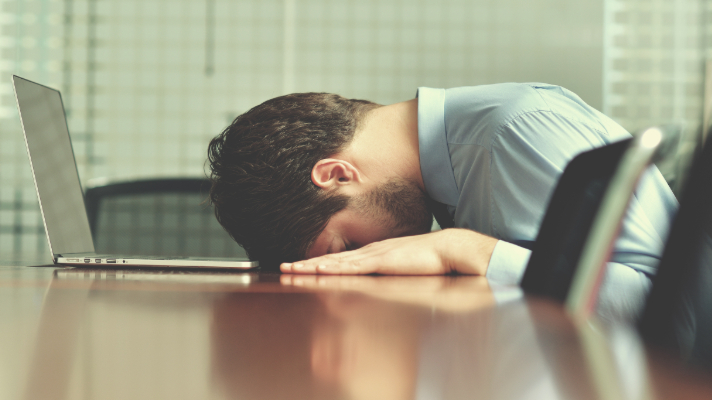 Frustrated man working on Excel Timesheet